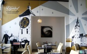 Decoratieve muurschildering met elementen uit de stad Lier voor brasserie Elzenhof